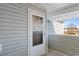 A cozy porch with a welcome sign and a view of the pond beyond, creating an inviting entrance at 8861 Chandler Dr. # F, Surfside Beach, SC 29575