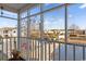 View from screened porch overlooking landscaped community with a tranquil pond at 8861 Chandler Dr. # F, Surfside Beach, SC 29575
