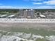 Wide aerial shot showcasing the resort, sandy beach, and ocean waves at 9550 Shore Dr. # 1430, Myrtle Beach, SC 29572