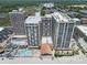 Expansive aerial view capturing the oceanfront resort, pool, beach, and surrounding landscape at 9550 Shore Dr. # 1430, Myrtle Beach, SC 29572