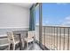 Enjoy ocean views from the balcony with a table and chairs at 9550 Shore Dr. # 1430, Myrtle Beach, SC 29572
