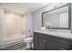 Bathroom showcases a vanity with granite countertop and a shower/tub combo at 9550 Shore Dr. # 1430, Myrtle Beach, SC 29572