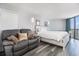 A relaxing bedroom with seating, coastal decor, and ocean views at 9550 Shore Dr. # 1430, Myrtle Beach, SC 29572