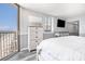 A bright and airy bedroom is complemented by a dresser with storage and a view at 9550 Shore Dr. # 1430, Myrtle Beach, SC 29572