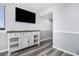 A calming living area is furnished with a mounted TV, console, and coastal decor at 9550 Shore Dr. # 1430, Myrtle Beach, SC 29572