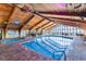 Indoor swimming pool with an angled wood ceiling and windows facing the ocean at 9550 Shore Dr. # 1430, Myrtle Beach, SC 29572