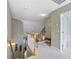 The second-floor hallway includes stairs, and an open view of the lower level at 100 Culpepper Way # 1003, Myrtle Beach, SC 29579