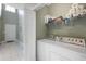 Convenient laundry room with washer, dryer, and overhead shelving for ample storage at 100 Culpepper Way # 1003, Myrtle Beach, SC 29579