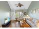 Cozy living room with a vaulted ceiling, hardwood floors, and large windows offering plenty of natural light at 100 Culpepper Way # 1003, Myrtle Beach, SC 29579