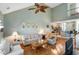 Open floor plan featuring high ceilings and hardwood floors connecting the living and kitchen areas at 100 Culpepper Way # 1003, Myrtle Beach, SC 29579
