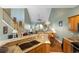 Open concept living area with vaulted ceilings, granite counters, and hardwood floors at 100 Culpepper Way # 1003, Myrtle Beach, SC 29579