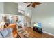 Spacious open-concept living area with hardwood floors and a staircase leading to the upper level at 100 Culpepper Way # 1003, Myrtle Beach, SC 29579