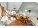 Open floor plan featuring a living room and dining area with hardwood floors and plenty of natural light at 100 Culpepper Way # 1003, Myrtle Beach, SC 29579