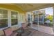 View of a screened-in patio with ceiling fan, patterned concrete, and outdoor furniture, perfect for relaxation at 100 Culpepper Way # 1003, Myrtle Beach, SC 29579