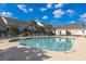 Large community pool featuring clear water, plenty of seating, and well-maintained landscaping for residents to enjoy at 100 Culpepper Way # 1003, Myrtle Beach, SC 29579