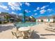 Community pool area with comfortable lounge chairs and tables, creating a perfect spot for relaxation and social gatherings at 100 Culpepper Way # 1003, Myrtle Beach, SC 29579