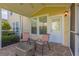 Inviting screened porch with comfortable seating and a peaceful outdoor view at 100 Culpepper Way # 1003, Myrtle Beach, SC 29579