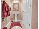 Bathroom featuring a pedestal sink, pink walls, and decorative towels at 105 Willow Bay Dr., Murrells Inlet, SC 29576