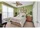Inviting bedroom with carpet, ceiling fan, and bedside tables with lamps at 105 Willow Bay Dr., Murrells Inlet, SC 29576