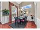 Dining room boasts hardwood floors, large windows, and decorative curtains at 105 Willow Bay Dr., Murrells Inlet, SC 29576