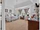 Spacious main bedroom with a large bed, sitting area, and chandelier at 105 Willow Bay Dr., Murrells Inlet, SC 29576