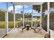 Screened-in porch features lovely view of the lake at 105 Willow Bay Dr., Murrells Inlet, SC 29576