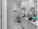 Elegant bathroom with a tiled shower, white cabinets, and counter storage at 1078 Saltgrass Way, Myrtle Beach, SC 29588