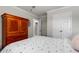 Bedroom features a bed, large armoire, and a closet for storage, ensuring organization and style at 1078 Saltgrass Way, Myrtle Beach, SC 29588