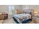 Comfortable bedroom featuring a decorative headboard, window, and a dresser at 1078 Saltgrass Way, Myrtle Beach, SC 29588