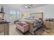 Cozy bedroom featuring a comfortable bed, ceiling fan, and shiplap accent wall at 1078 Saltgrass Way, Myrtle Beach, SC 29588