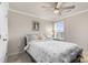 Bedroom features a queen bed, shutters on the windows, ceiling fan, and crown molding at 1078 Saltgrass Way, Myrtle Beach, SC 29588