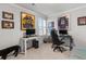 Bedroom features a desk with computers and sports memorabilia on the wall at 1078 Saltgrass Way, Myrtle Beach, SC 29588