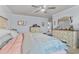 Spacious bedroom featuring stylish dressers, a fan, and neutral walls at 1078 Saltgrass Way, Myrtle Beach, SC 29588