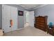 This bedroom features an en suite bath, ample closet space, and neutral-toned walls at 1078 Saltgrass Way, Myrtle Beach, SC 29588