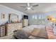 Bright bedroom features lots of natural light, neutral paint and a ceiling fan at 1078 Saltgrass Way, Myrtle Beach, SC 29588