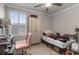Bedroom features a fan, a closet, a desk with chair, and a bed at 1078 Saltgrass Way, Myrtle Beach, SC 29588