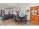 Dining area showcasing hardwood floors and access to the adjacent living room at 1078 Saltgrass Way, Myrtle Beach, SC 29588