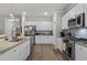 Modern kitchen featuring granite countertops, stainless steel appliances, and ample cabinet space at 1078 Saltgrass Way, Myrtle Beach, SC 29588
