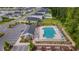 Aerial view of the community pool and surrounding amenities, including lounge chairs and a playground at 1078 Saltgrass Way, Myrtle Beach, SC 29588