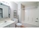 Bright bathroom features a shower/tub combo, toilet, and vanity sink with a large framed mirror at 1125 Blue Stem Dr. # 29F, Pawleys Island, SC 29585