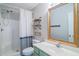 Well lit bathroom featuring walk in shower, decor shelves and vanity at 1125 Blue Stem Dr. # 29F, Pawleys Island, SC 29585