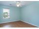 Cozy bedroom with light blue walls, hardwood floors, and bright window at 1125 Blue Stem Dr. # 29F, Pawleys Island, SC 29585