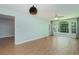 View of a living room with wood floors and view of door to the outside at 1125 Blue Stem Dr. # 29F, Pawleys Island, SC 29585