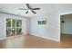 Living room with ceiling fan, sliding glass door to outdoor patio and tv at 1125 Blue Stem Dr. # 29F, Pawleys Island, SC 29585