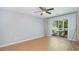Living room with sliding glass door to outdoor patio and ceiling fan at 1125 Blue Stem Dr. # 29F, Pawleys Island, SC 29585