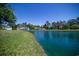 Beautiful pond surrounded by lush green lawns and trees, offering picturesque views of the community at 1125 Blue Stem Dr. # 29F, Pawleys Island, SC 29585