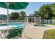 Community pool featuring a hot tub, green umbrellas, and outdoor seating area at 1125 Blue Stem Dr. # 29F, Pawleys Island, SC 29585