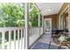 Enjoy a morning coffee on the screened balcony with views of the beautiful yard and mature trees at 1125 Blue Stem Dr. # 29F, Pawleys Island, SC 29585