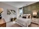 Stylishly decorated bedroom with patterned wallpaper, accent lamps, and a cozy bed with decorative pillows at 115 Northbrook Dr, Murrells Inlet, SC 29576