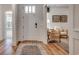 Inviting foyer with wood flooring, elegant decor, and a view into the adjacent living area at 115 Northbrook Dr, Murrells Inlet, SC 29576